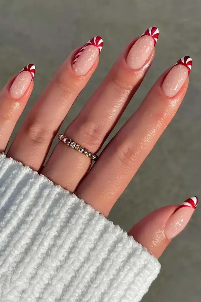 Red and white candy-inspired French nails. by v.nailedit_
