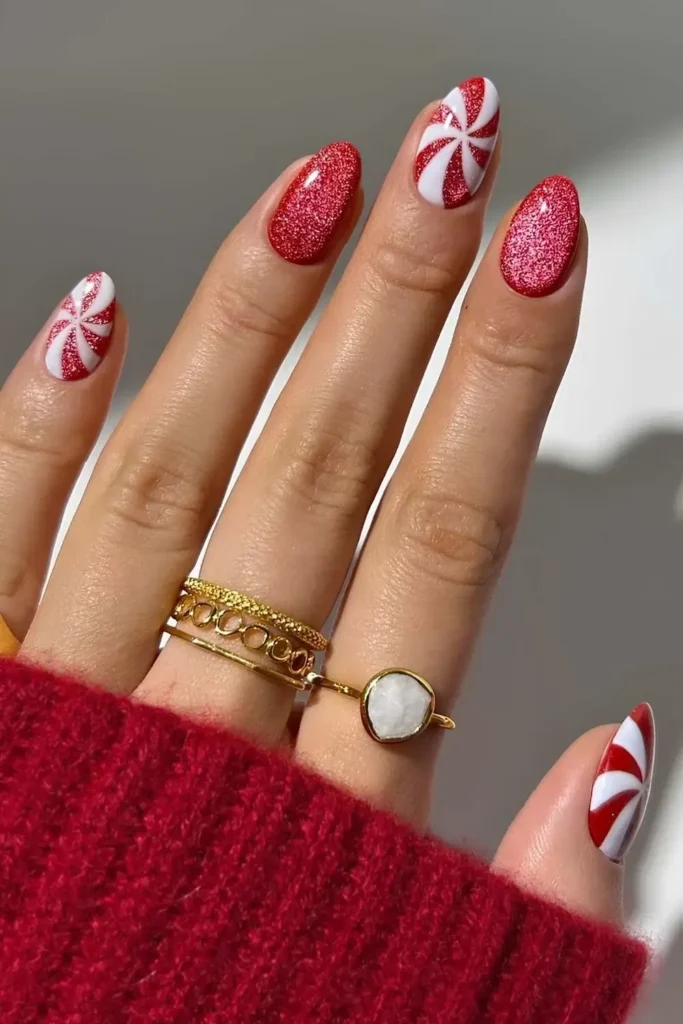 Red velvet mani with Christmas peppermint art. by thenaillologist