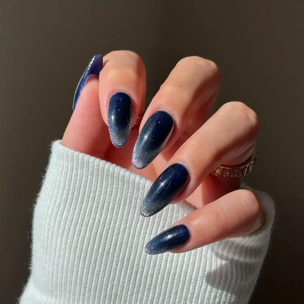 Sapphire blue velvet tips on a neutral base. by disseynails
