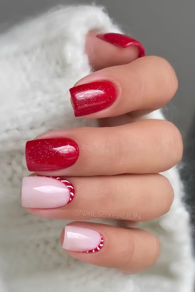 Shimmery red nails with minimalist candy cane art. by nailsbypaulin
