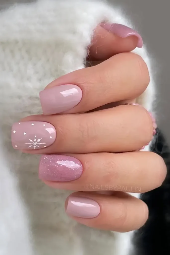 Short pink Christmas nails with snowflakes. by nailsbypaulin