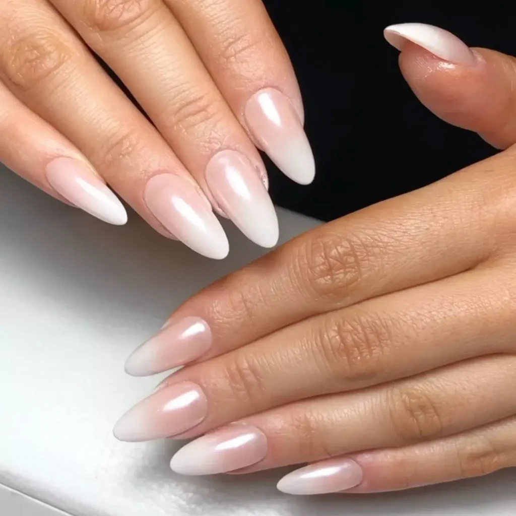 Smooth white ombré nails with a chrome finish. by sassnailartistry
