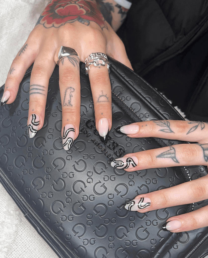 Snake-pattern-in-black-color-paired-with-classic-French-tips by 1999houseofnailsnz