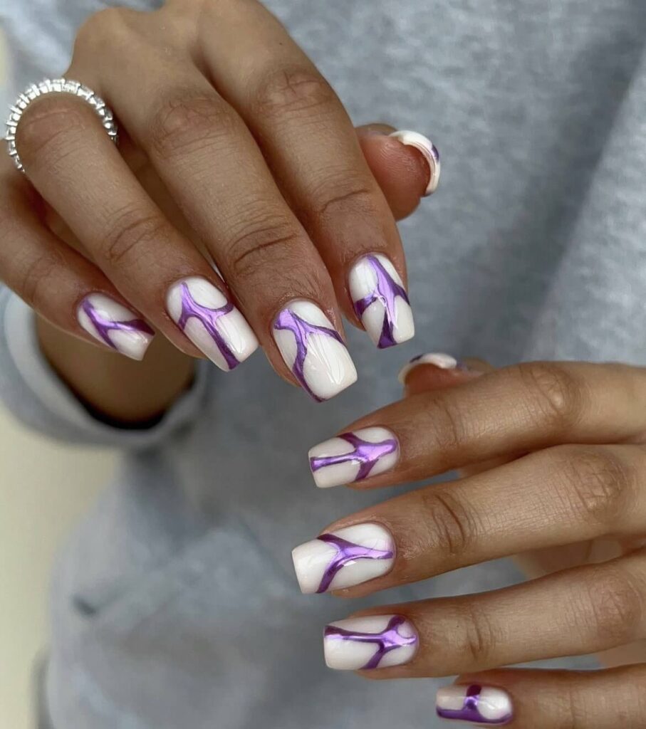 White nails with a purple abstract pattern. by jodiesbeaute